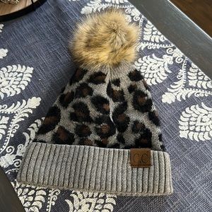 C.C cheetah hat with fluff ball on top